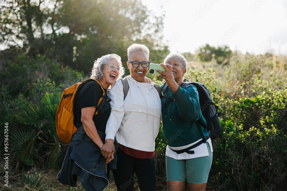 Senior women taking selfie while hiking in nature Senior women taking selfie while hiking in nature