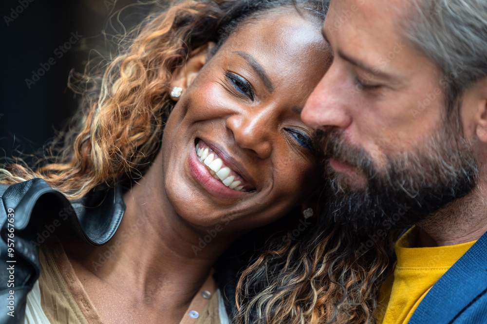 Multiracial couple sharing an affectionate moment outdoors Multiracial couple sharing an affectionate moment outdoors