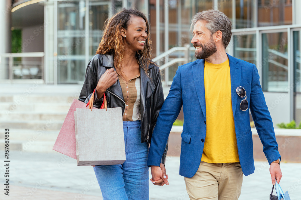 Couple enjoying a shopping day in the city center Couple enjoying a shopping day in the city center