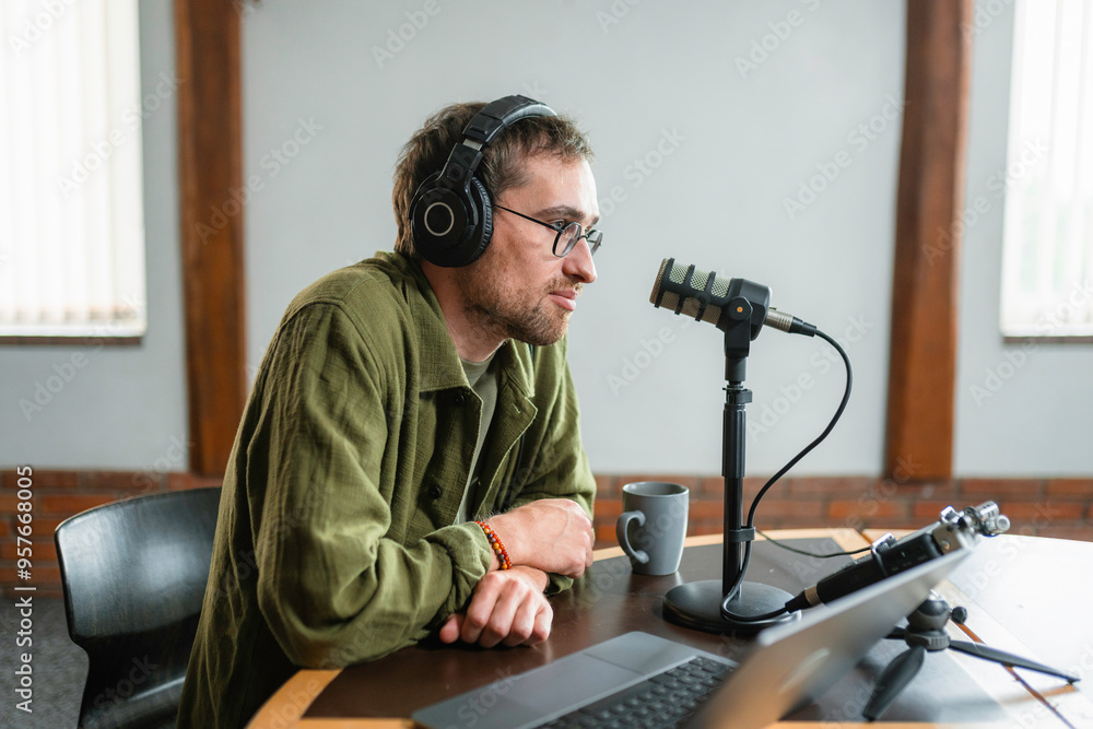 A man records a podcast A man records a podcast