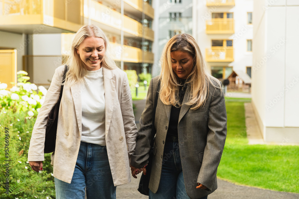 LGBT Woman Couple Walking Home Holding Hands LGBT Woman Couple Walking Home Holding Hands