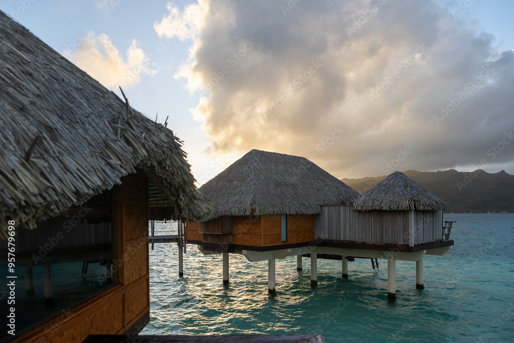 Overwater bungalow hut on a tropical island resort. The popular tourist accommodations are luxurious with a view of paradise. Overwater bungalow hut on a tropical island resort. The popular tourist accommodations are luxurious with a view of paradise.