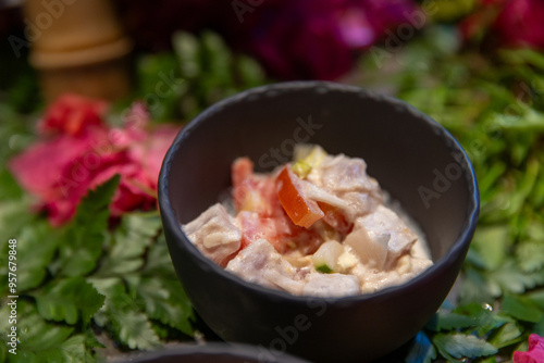 Poisson cru, a traditional raw fish salad in French Polynesia made with fresh, raw tuna, vegetables, lime juice, and coconut milk. It is the national dish of Tahiti similar to poke or ceviche/ 