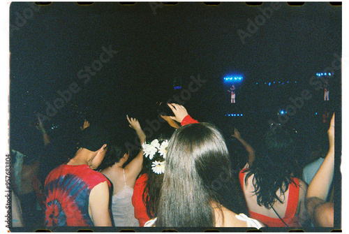 Concert attendees wearing red shot on 35mm film photo