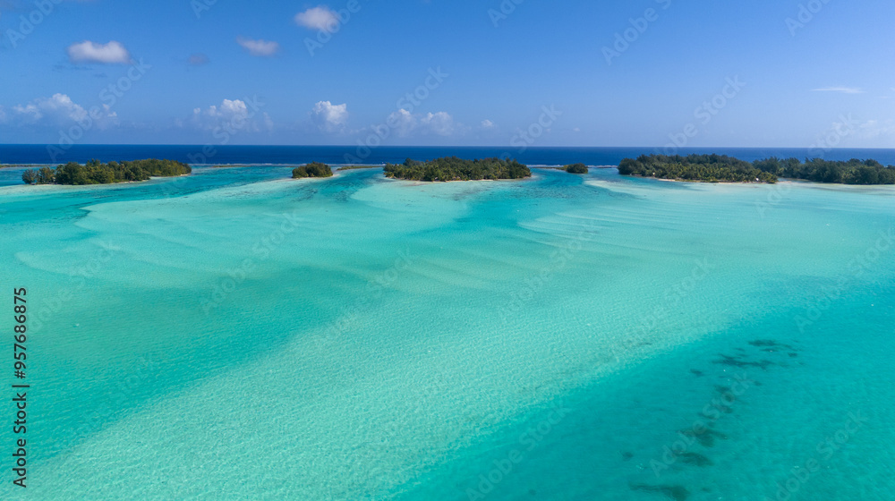 Vibrant azure blue south pacific ocean water. The clear sea reveals beautiful coral reefs at Bora Bora island in French Polynesia. Vibrant azure blue south pacific ocean water. The clear sea reveals beautiful coral reefs at Bora Bora island in French Polynesia.