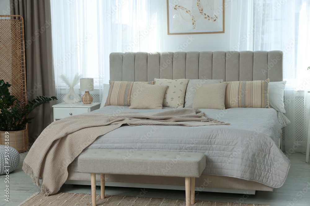Obraz premium Big comfortable bed in room. Interior design