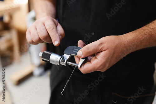 Technician Measuring Piano Wire