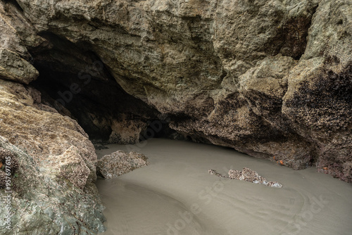 Untouched Sand Leads Into Dark Sea Cave At Low Tide On Meyers Beach photo