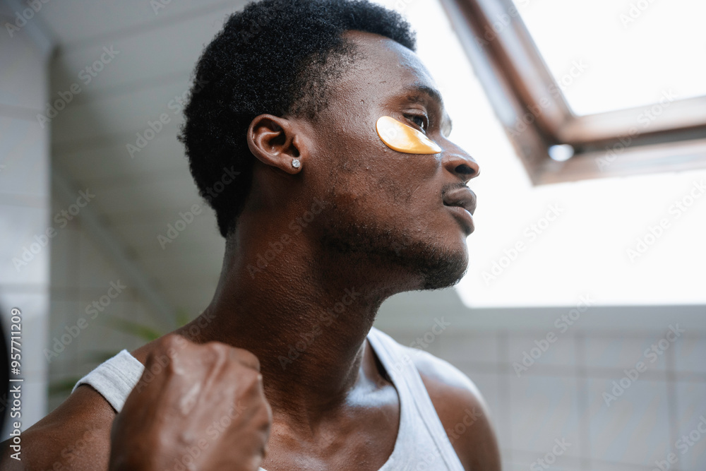 A man puts on eye patches A man puts on eye patches