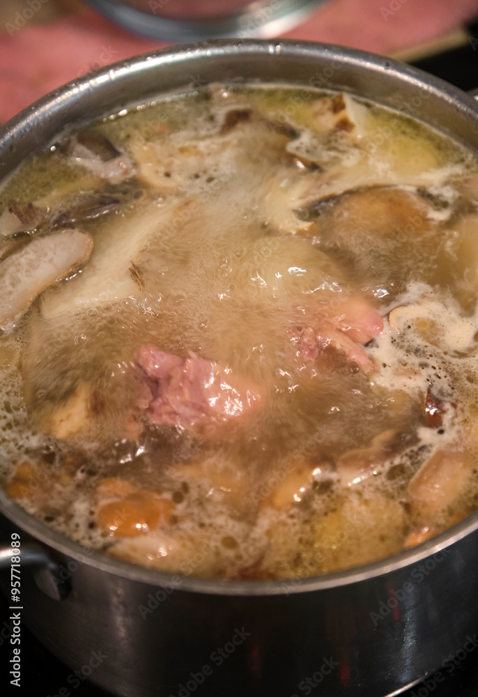 Closeup of boiling wild mushroom chicken soup Closeup of boiling wild mushroom chicken soup