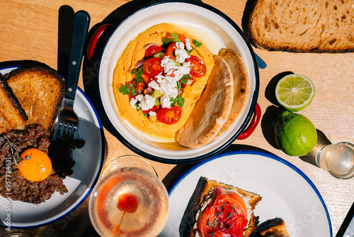 Gourmet Beef Tartar and Hummus Topped with Tomatoes