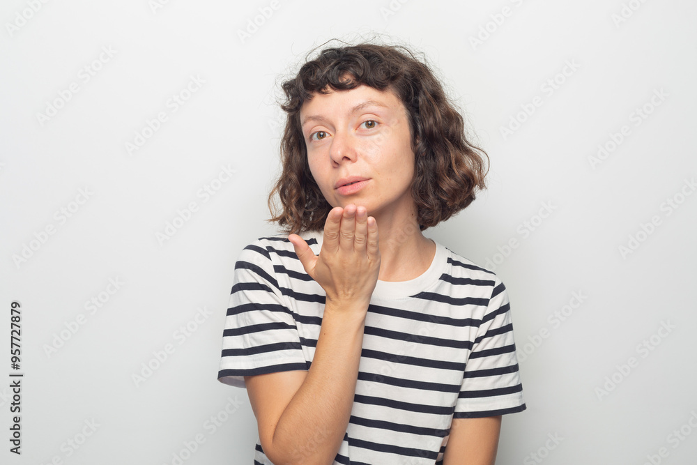 Young woman blowing a kiss Young woman blowing a kiss