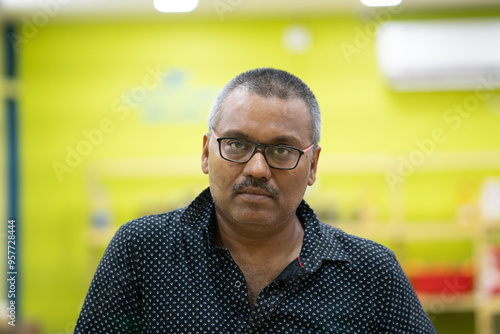 Indian middle aged man inside a departmental store photo