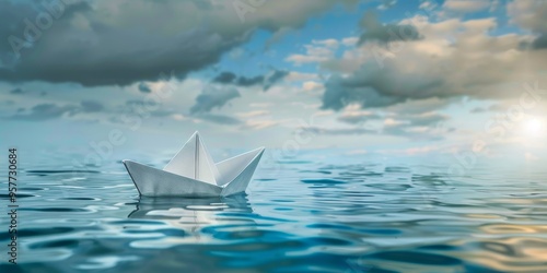 Conceptual image of a paper boat floating on water, symbolizing childhood and imagination