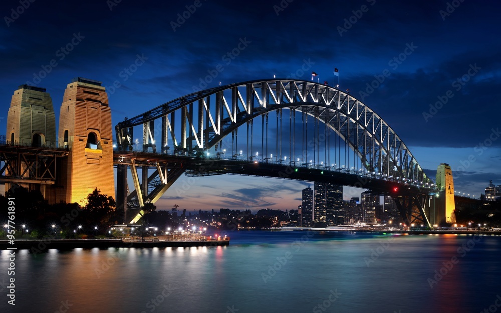 Obraz premium Harbour Bridge at Night: Illuminated Sydney Skyline with Reflections Background