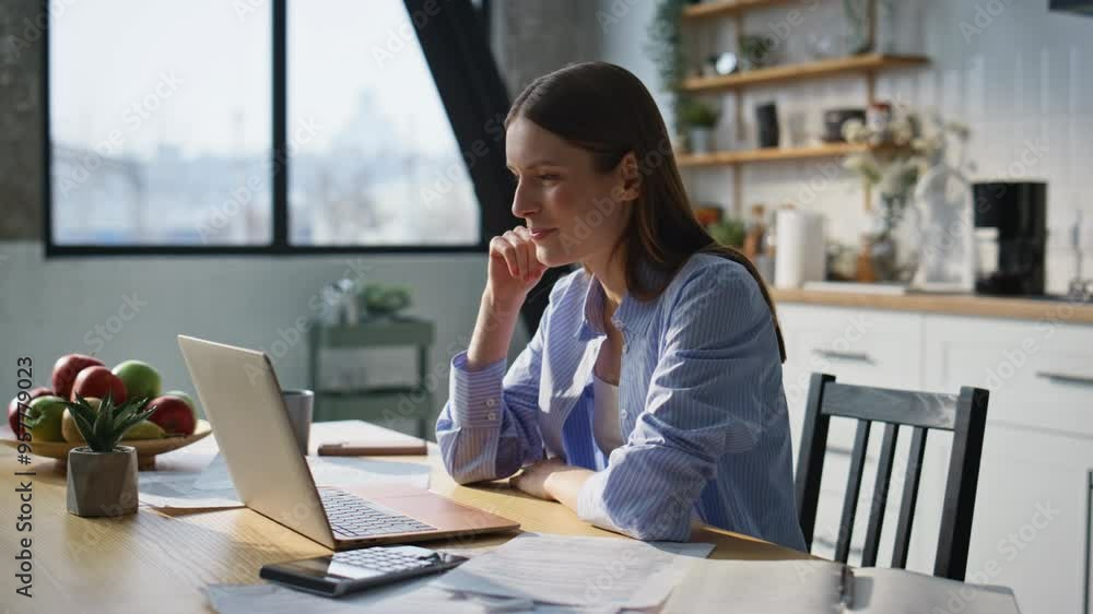 Cheerful woman video calling by laptop at home office closeup. Happy freelancer Cheerful woman video calling by laptop at home office closeup. Happy freelancer