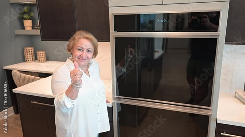 woman loves her new twin oven installation after a kitchen remodel photo