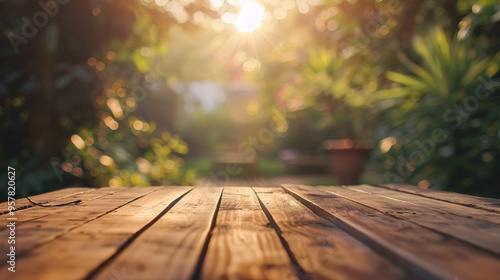 07240954 193. A smooth wooden table in the foreground, with a blurred background of a sunlit garden, capturing the essence of a tranquil and relaxed environment photo