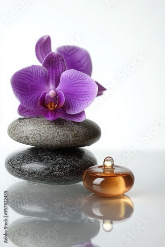 A serene composition featuring a purple orchid flower, stacked stones, and an elegant bottle, perfect for wellness and relaxation themes.