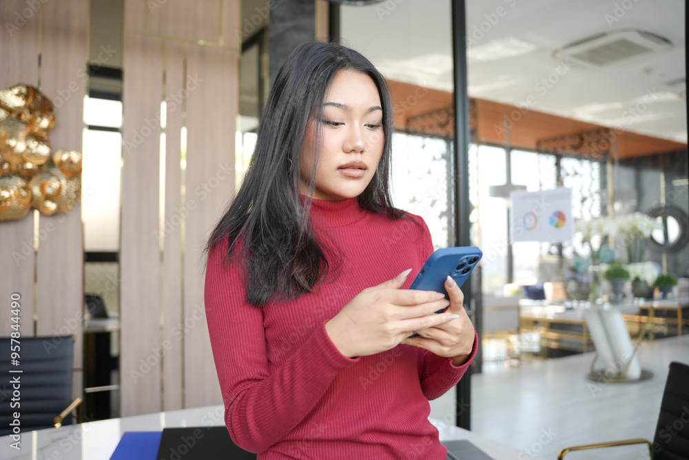 Fototapeta premium Asian woman using smartphone&nbsp;mobile addict spending time checking news social media cell telephone technology e-commerce concept.