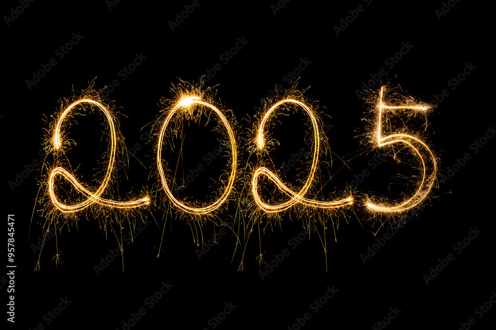 Happy New Year 2025. Burning sparkling text 2025 isolated on black background. Happy New Year 2025. Burning sparkling text 2025 isolated on black background.