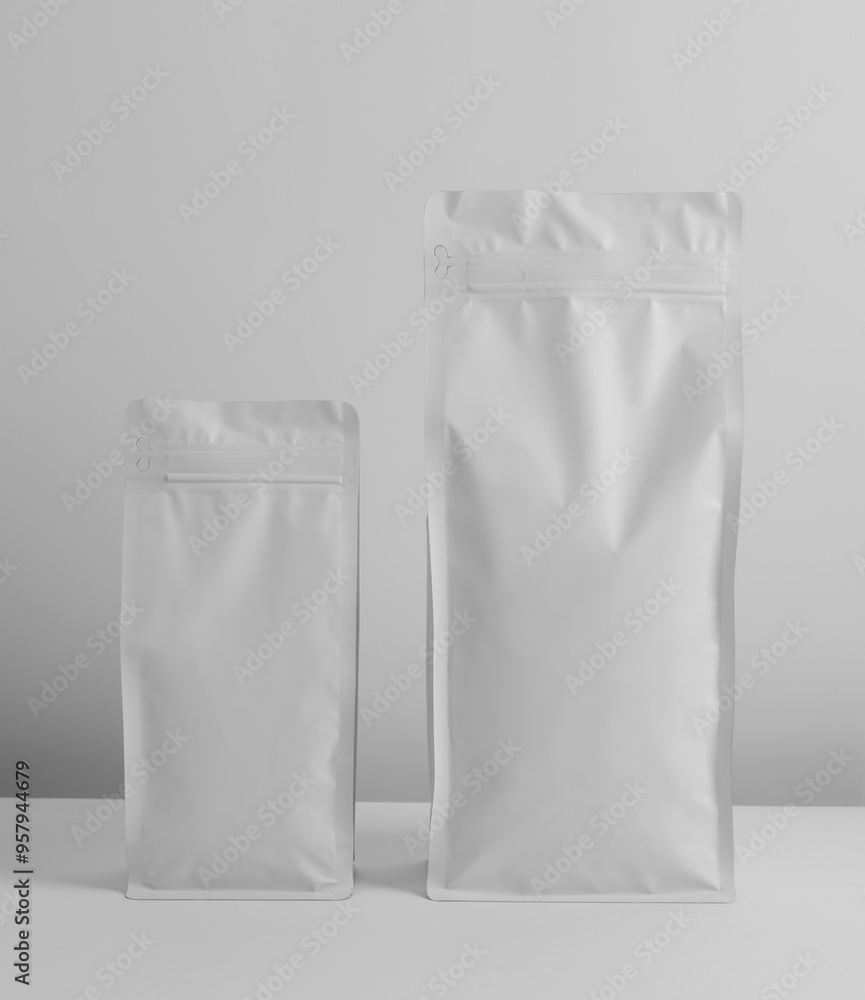 Foil plastic bag packaging with zipper and pile of seed for pet food or roasted coffee beans or tea, template isolated on a white background. Package mock-up Foil plastic bag packaging with zipper and pile of seed for pet food or roasted coffee beans or tea, template isolated on a white background. Package mock-up
