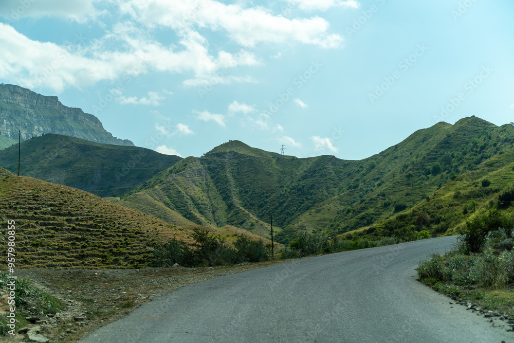 Fototapeta premium View from the car of an asphalt road in the mountainous area of Dagestan