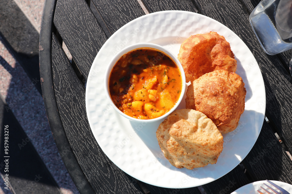 Indian cuisine - Puri Bhaji. It is a traditional breakfast dish in ...