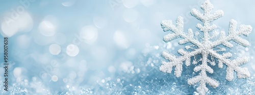  A tight shot of a solitary snowflake against a backdrop of blue, with a softly blurred swirl of surrounding snowflakes photo