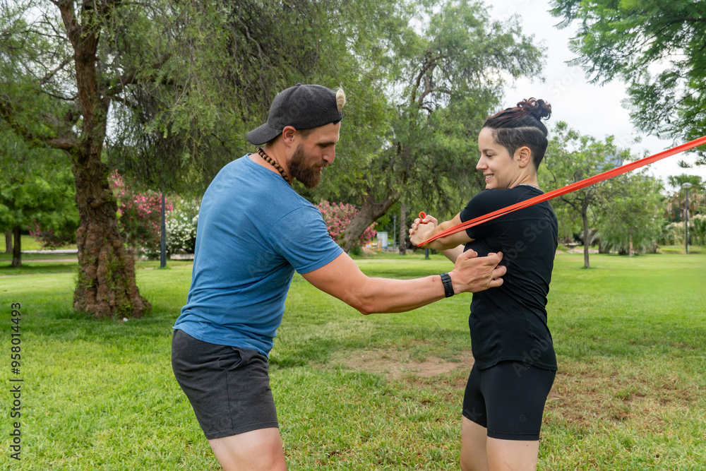 Strength and resistance training outdoors with exercise bands. Strength and resistance training outdoors with exercise bands.