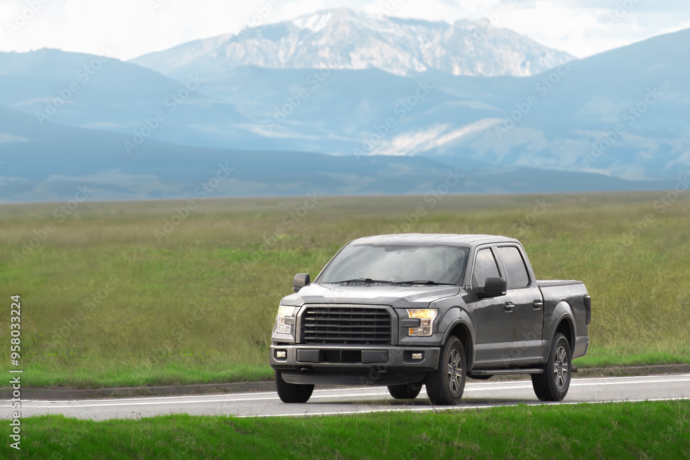 Sturdy pickup truck on a misty rural road Sturdy pickup truck on a misty rural road