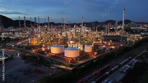 Oil Refinery plant at sunset. Gas Chemical Equipment Prodiction import export Concept, Crude Oil Refinery Plant Steel Pump Pipe line and Chimney and Cooling tower, Chemical Petrochemical