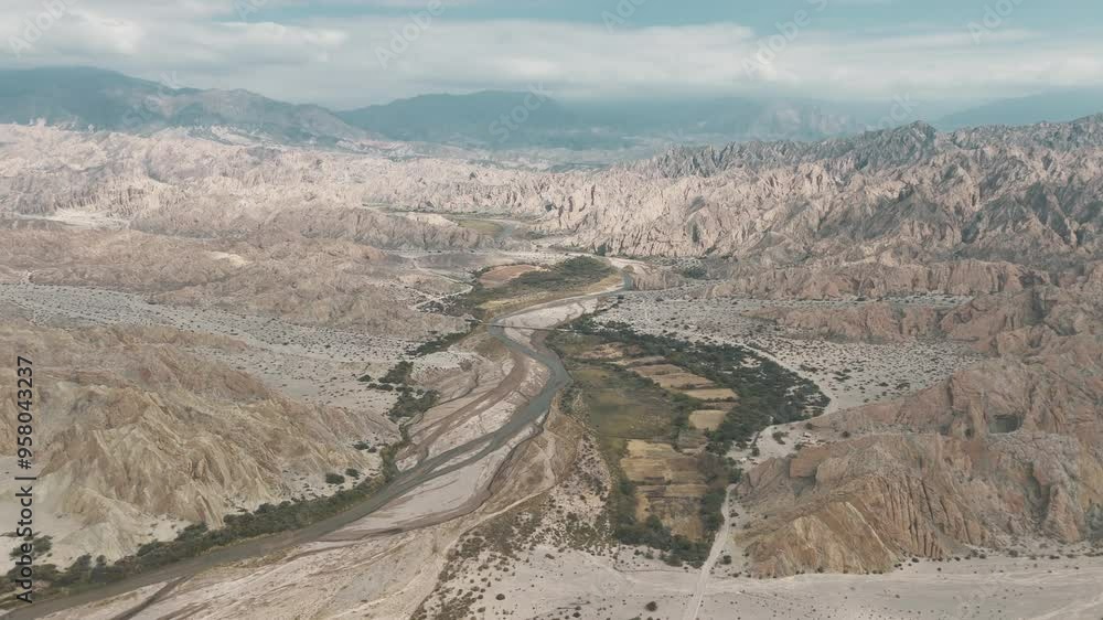 High altitude aerial view about the Rio Calchaqui bridge environment, Salta, Argentina, South America. High altitude aerial view about the Rio Calchaqui bridge environment, Salta, Argentina, South America.