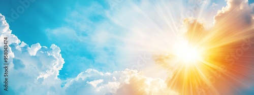  A bright sun illuminates the blue sky, speckled with white and yellow clouds in the foreground