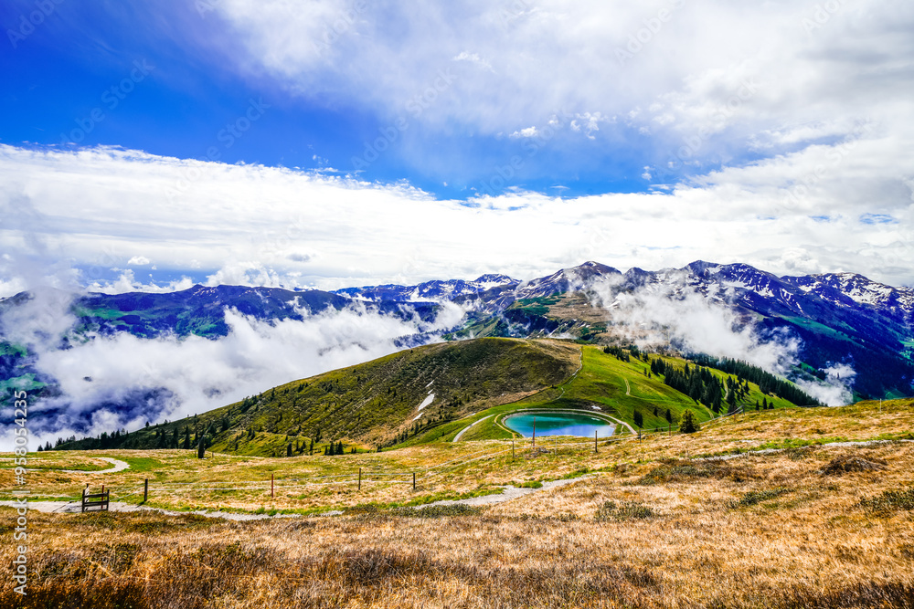 Fototapeta premium View from Schatzberg of the surrounding landscape. Idyllic nature in Wildschönau in the Kufstein district in Austria. Mountain landscape in the Kitzbühel Alps in Tyrol. 