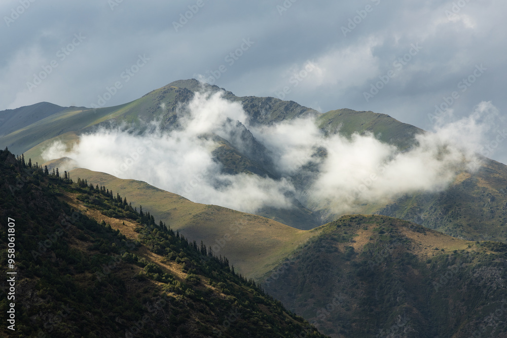 Clouds in the valley and rolling hills of Ala Archa national park Clouds in the valley and rolling hills of Ala Archa national park
