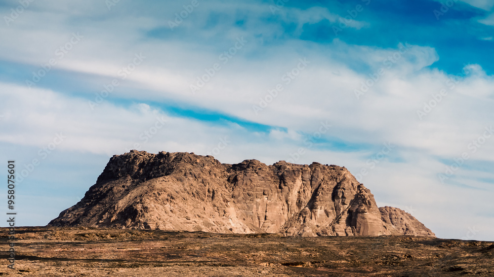 Obraz premium high mountain in the desert against the blue sky and white clouds in Egypt Dahab South Sinai