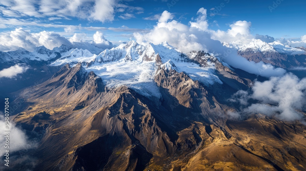 Fototapeta premium Aerial view of the majestic Huaytapallana Mountain, with snow-capped peaks and deep, icy crevasses