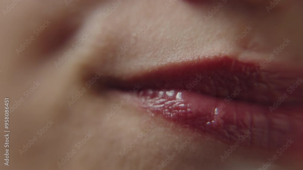 Mouth of girl, conflicted movement, red lips in closeup. Mouth of girl, conflicted movement, red lips in closeup.