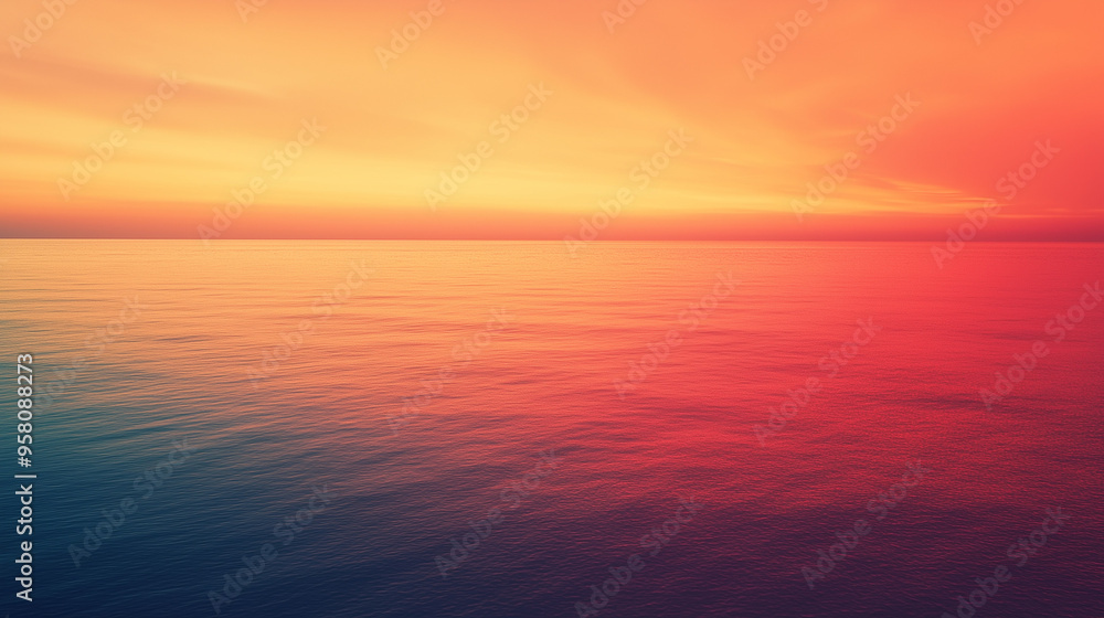 Obraz premium Serene ocean at sunset with vibrant sky, orange and red hues, peaceful background