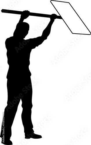 Protestor or demonstrator at a demonstration march, picket line or strike protest rally in silhouette. Holding up a banner or picket sign board placard.
