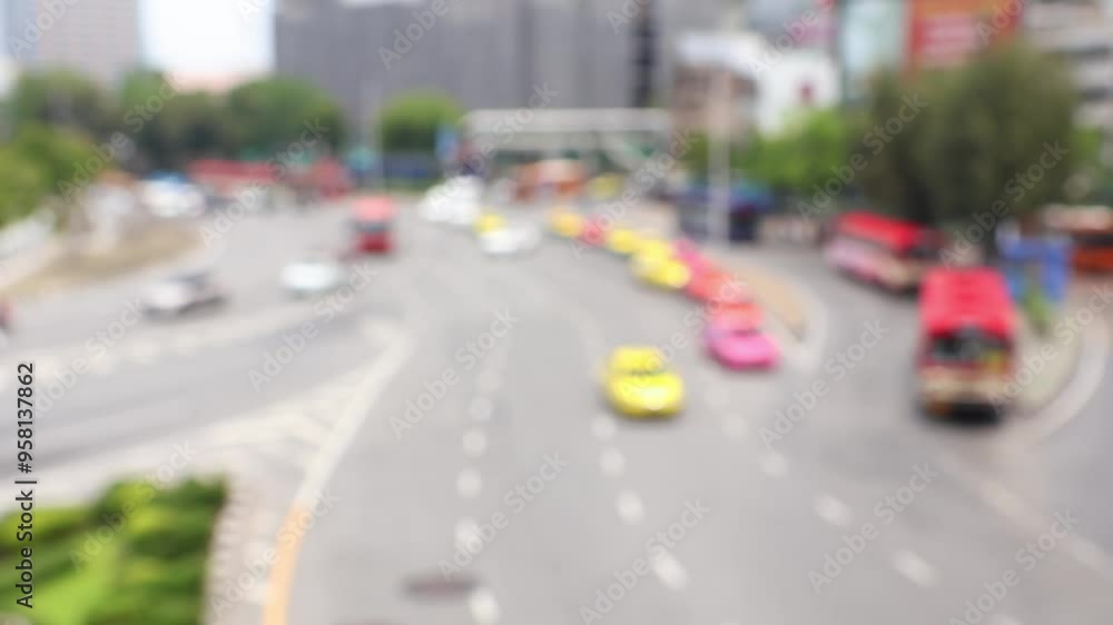 Road traffic near Victory Monument, Bangkok, Thailand. Bokeh of cars and blurred traffic lights. Road traffic near Victory Monument, Bangkok, Thailand. Bokeh of cars and blurred traffic lights.