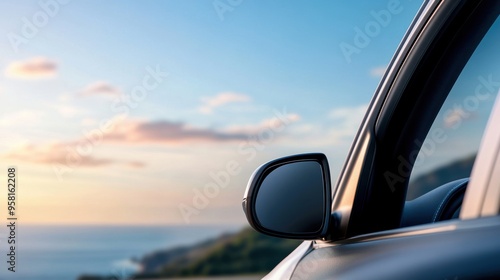 Inside a car driving on a coastal highway, ocean view to the side, motion blur conveying travel, vibrant sunset sky