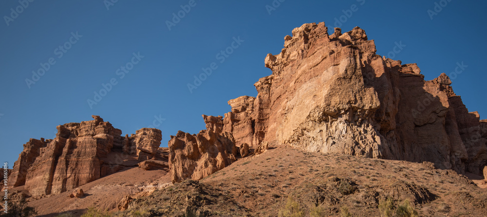 Fototapeta premium Easter background with Easter eggs and spring flowers. Easter composition with eggs on vintage white plates. Easter bunny napkin gift egg wrapping idea.