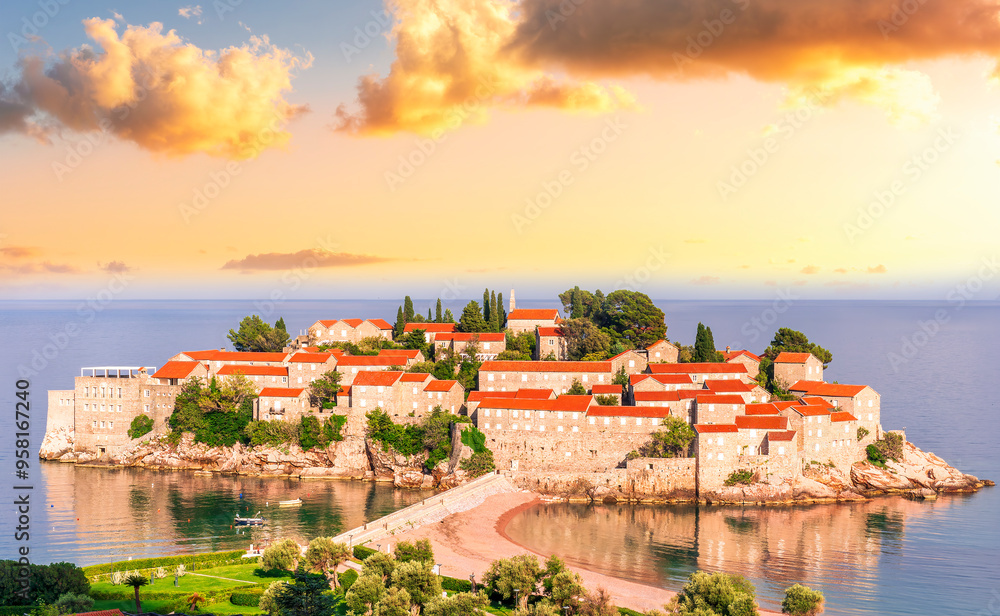Fototapeta premium panoramic landscape of sea island sunrise or sunset with beautiful orange roofs and buildings, sea gulf water and scrnic colorful morning cloudy sky on background