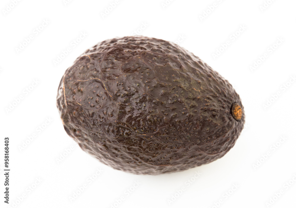 Fototapeta premium Ripe dark avocado on white background