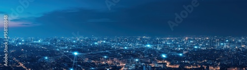 Stunning panoramic view of a vibrant city skyline illuminated by countless lights under a twilight sky.