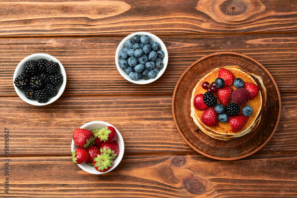 Stack of homemade american pancakes with berries . Top view Stack of homemade american pancakes with berries . Top view