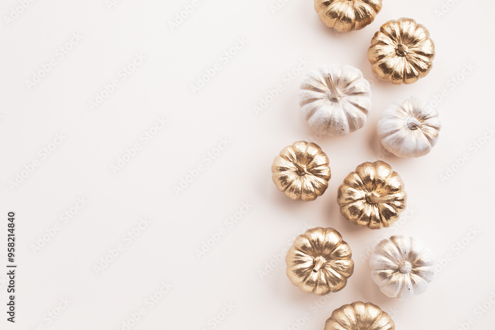 Stylized white and gold decorative pumpkins on a pale background for autumn and Thanksgiving cards. Stylized white and gold decorative pumpkins on a pale background for autumn and Thanksgiving cards.