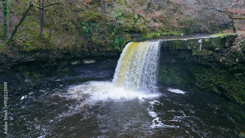 In a hidden vale where secrets hide, Sgwd Gwladys water flows with pride photo